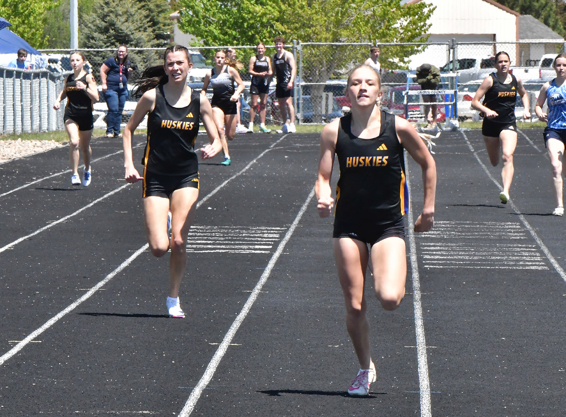 The Shelby-RC duo of Danica Watts (right) and Leah Whitmore (left) placed first and second respectively in both the 200 and 400 meter races. Watts also won both the long jump and the triple jump giving her a 40-point day at the Cross County Invite. PCN photo by Rick Holtz