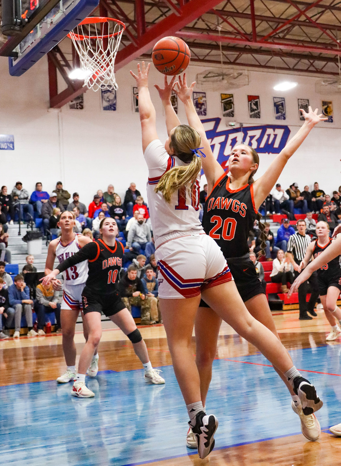 HallieJo Urkoski (HPC) and Halle Gabel go for the ball. PCN photo by Blaine Winslow.