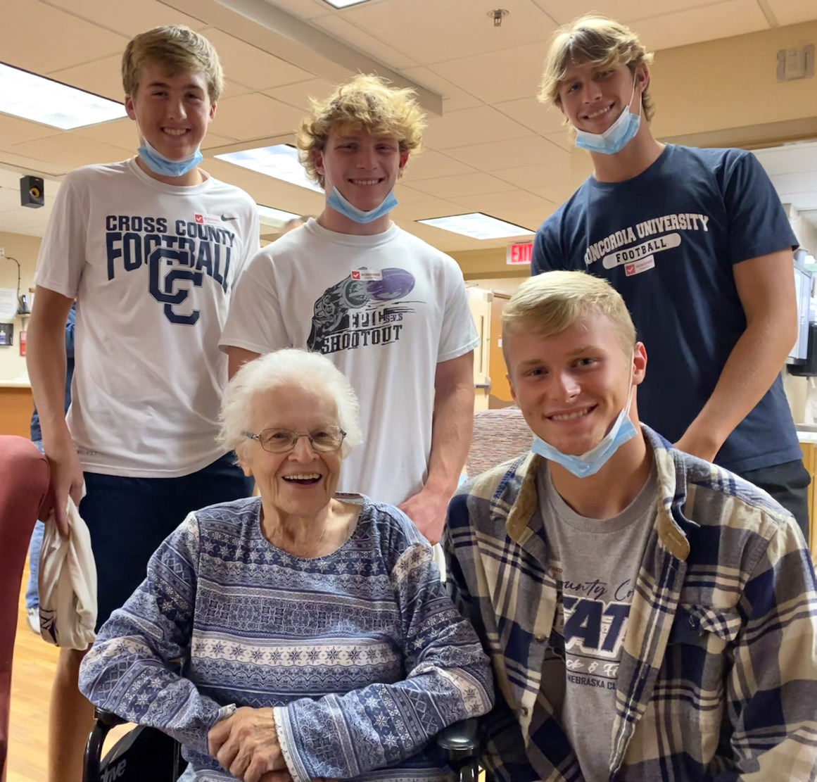 (left to right) Ashton Seim, Lottie Johnson, Izaac Dickey, Jackson Lindburg and Tanner Hollinger Lottie Johnson was visited by Cross County athletes (which included her great-grandson Jackson) and presented with a Cougar t-shirt as the MCH Fan of the Week. T-shirt provided by Cross County Booster Club.Photo provided by Erin Dickey.