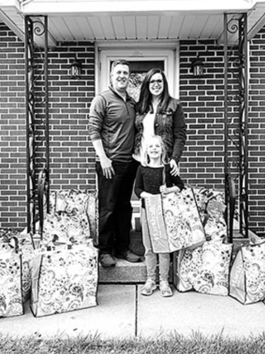 Sean and Lauren Erickson alongside their daughter Kennady, (Rex - not pictured), are pictured with the ‘thinking of you’ bags recently donated to Polk County Senior Services.