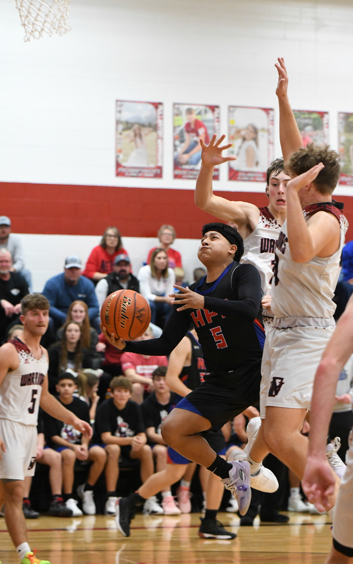 Raul Marino takes the ball to the basket past some Fullerton defenders. PCN photo by Rick Holtz.