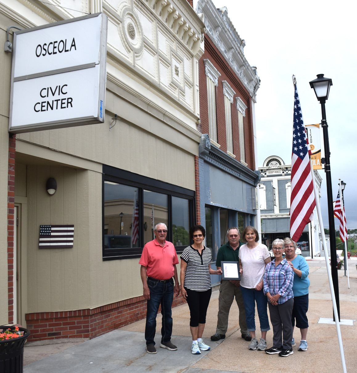 An organization and couple were recently recognized for faithfully flying the flag in Osceola. Above: The Osceola Senior Center, PCN photo by Beth Sparrow. Below: Jim and Diana Langer, PCN photo by Cienna Friesen.