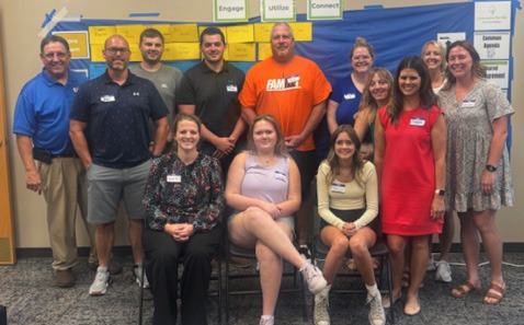 Stromsburg community members gather to start the Strong Roots Collaborative. Pictured are: Kurt Moore, Ken Booth, Cale Pallas, Treyten Nienhueser, Brent Hollinger, Liz Hamm, Jenni Conkel, Chandra Berlin (C4K), Lynn Blex, Jessica Pallas. Sitting: Sarah Hubel, Gracelyn Everingham, Ella Cramer (Student Representatives) Not Pictured: Tonya Kaup and Mike Rheiner. Photo provided.