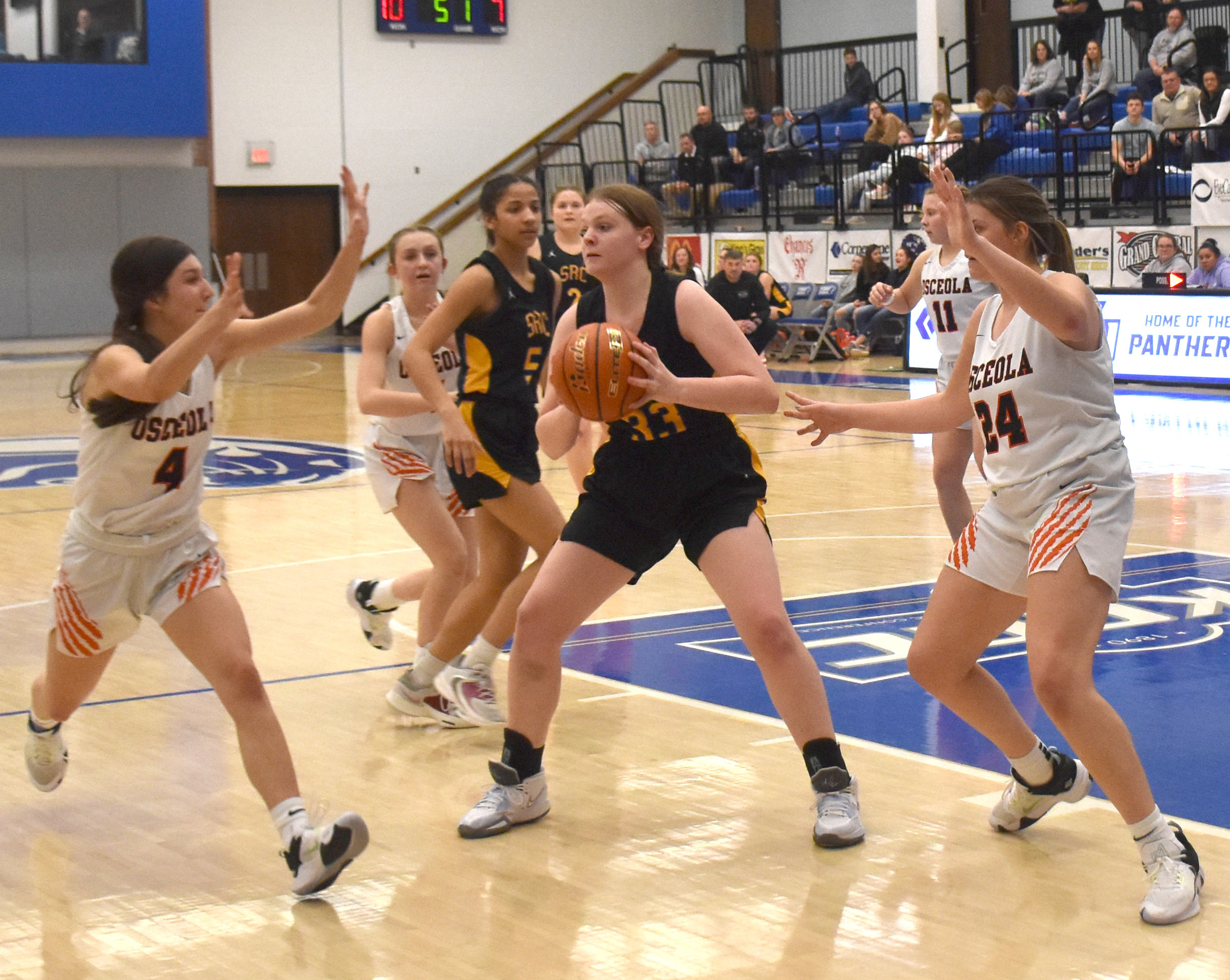 Osceola's Rori Wieseman collapses the defense on Shelby-Rising City's Caydee Bauers in Saturday's matchup at the Crossroads Conference Tournament. PCN photo by Beth Sparrow