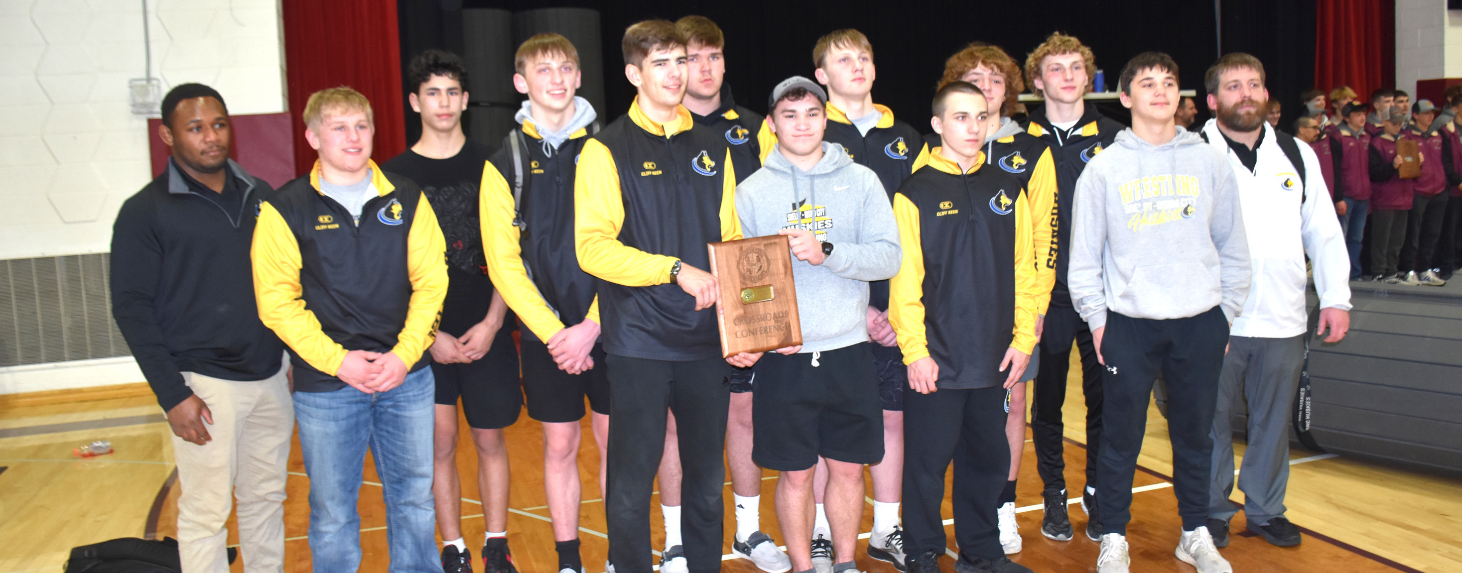 ABOVE: The Shelby-Rising City Huskies are crowned conference champs for the second year in a row. BELOW RIGHT: Seniors Wyatt Urkoski (HPC) and Landon Sliva (SRC) placed first and second respectively in the 175 weight class. PCN photos by Beth Sparrow.