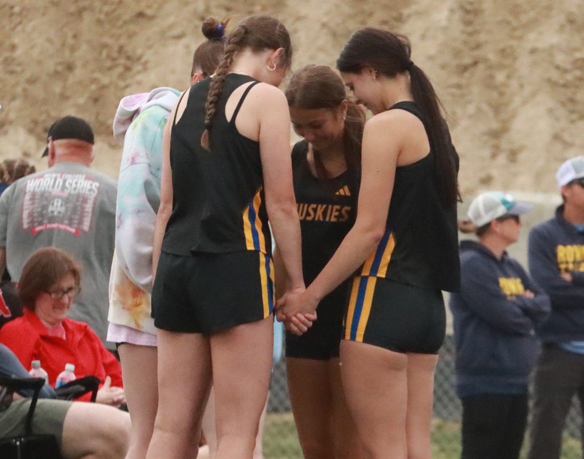 SRC high jumpers, Emma Rabourn, Kynlee Hamling and Alexis Wetjen take some time before start of event at C-2 Districts. PCN photo by Ken Kush