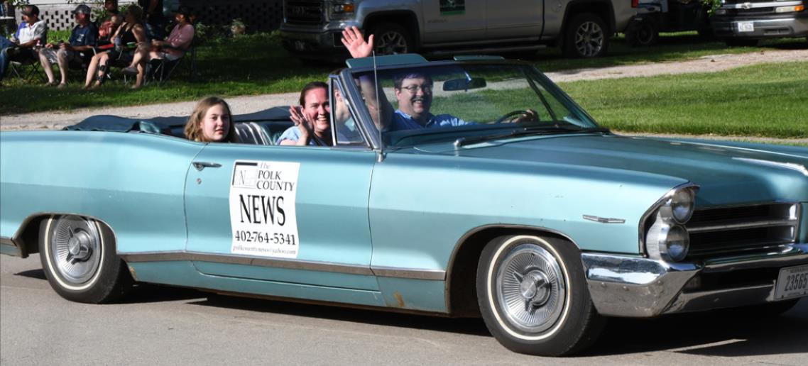 Polk County News Owners Alan and Beth Sparrow, along with their children, Kirk and Atalissa, drove in the Swedish Parade.
