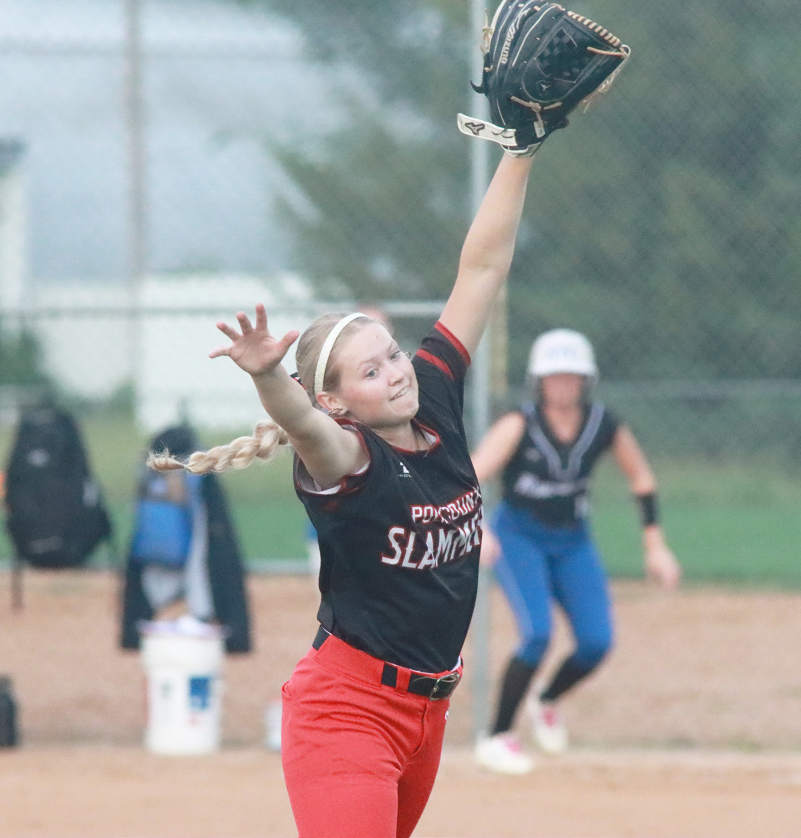 Above- Polk County/Aquinas second baseman Kelsey Brehm can’t get to this blooper in the first inning that lands just in the grass behind second base. PCA lost their opener at the Fillmore Central Tri to Hastings St. Cecilia, but bounced back to top the host Fillmore Central Panthers 9-8. PCN photos by Ken Kush.