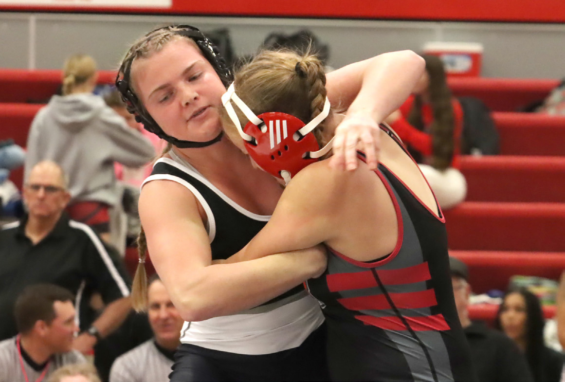 Cross County/Osceola senior Ema Dickey battles Camber Renz of Superior. Dickey placed fourth at 170. 