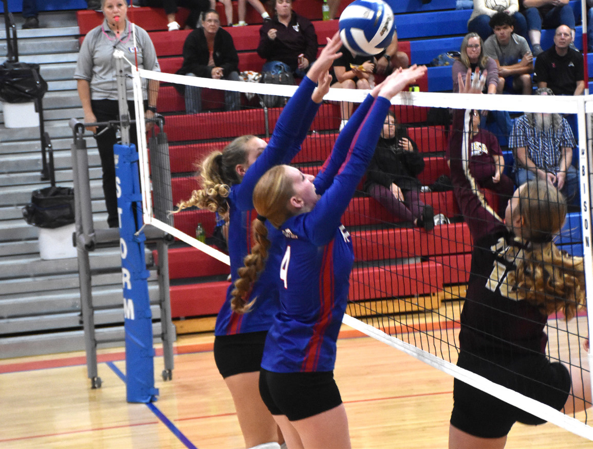 The Hofmann sisters (Rylee and Peyton) go up for the block against East Butler. PCN photo by Beth Sparrow