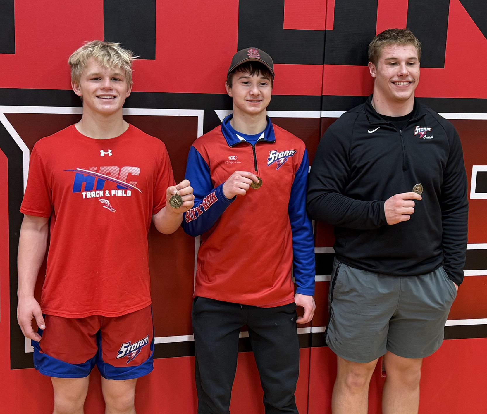 Three HPC senior wrestlers took first place at Pleasanton: Gage Friesen, Hudson Urkoski and Caleb Sharman. Photo provided.