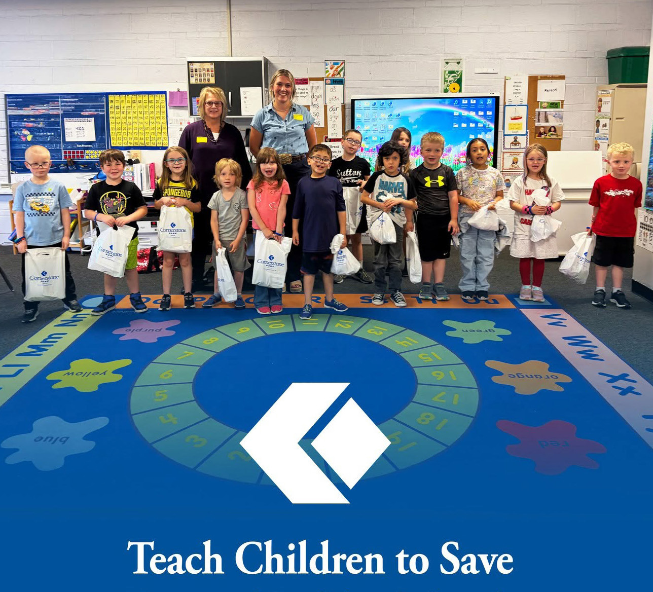 Above: As part of the national Teach Children to Save program, Cornerstone Bank employees visited preschool, kindergarten, and 1st grade students in April to teach the importance of saving money and building smart financial habits at an early age. Teach Children to Save is a nationwide financial education initiative that helps students learn healthy saving habits and basic money management skills through fun, age appropriate classroom activities and lessons. Photo provided.