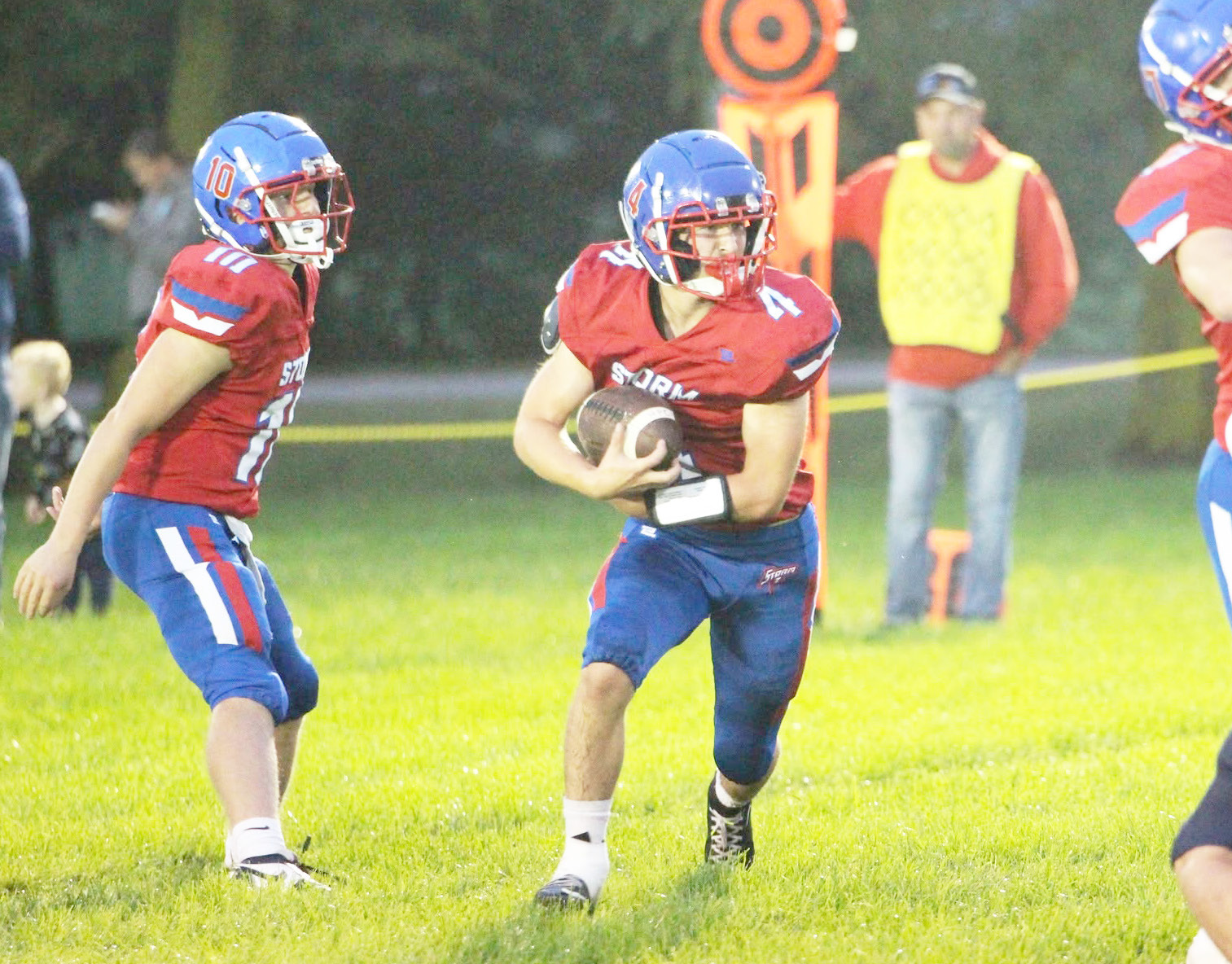 High Plains senior Aaron Brown takes the hand-off from senior QB Carson Swedenburg. Brown ran for two scores, caught a TD pass and was named Homecoming King. PCN photo by Travis Lane