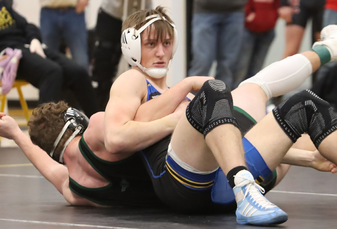 Top left- Junior Jett Vrbka improved to 15-0 as he won the 175-pound bracket at the SRC Invite. 