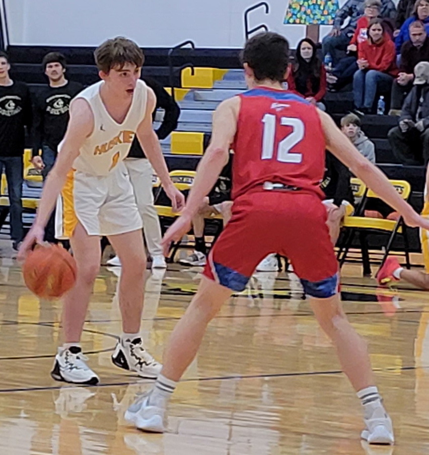 Gabe Dutton-Mofford sets up the offense for the Huskies as Hayden Helgoth plays defense for the Storm. PCN photo by Beth Sparrow
