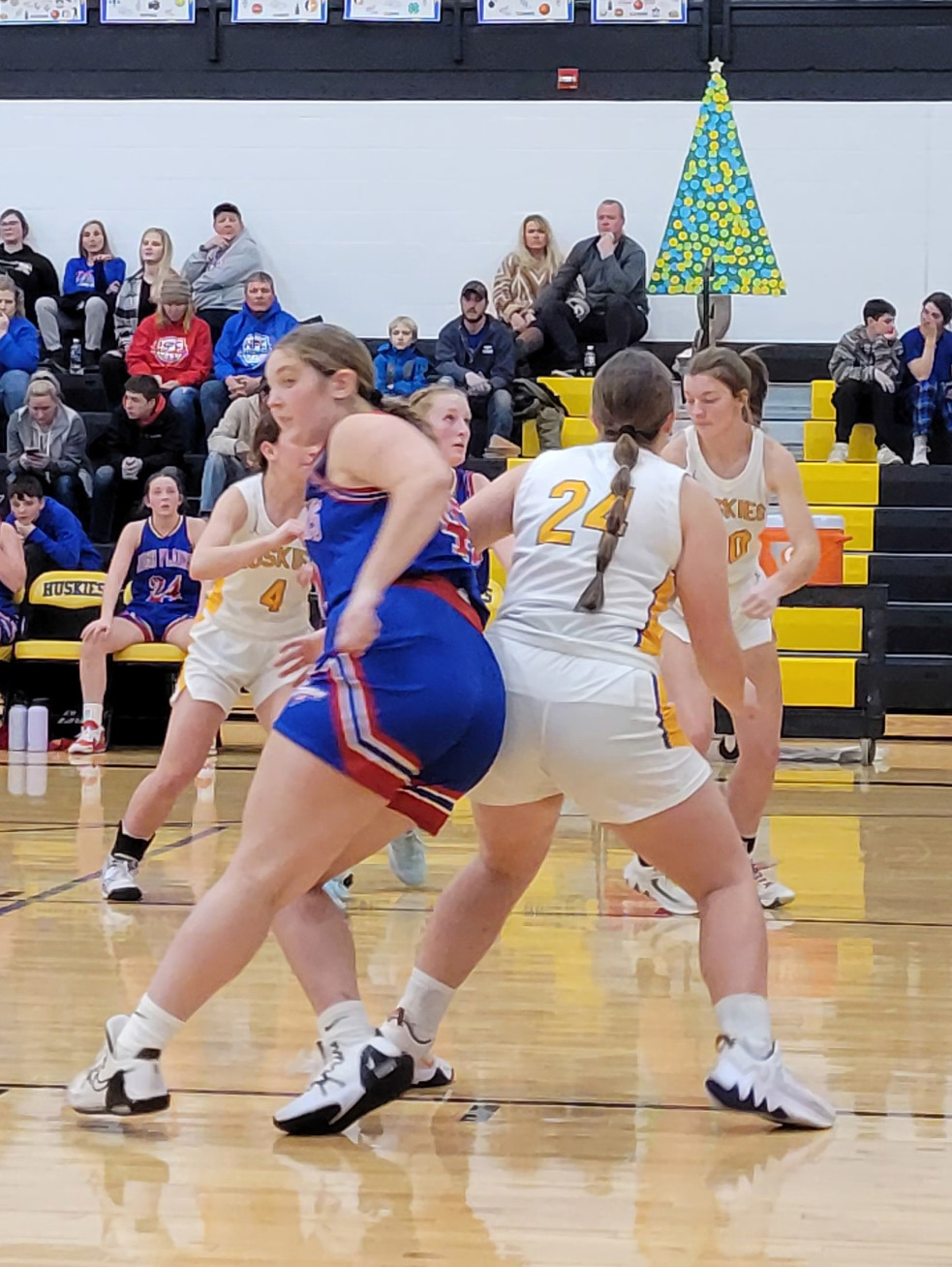 The Huskies and Storm battled for position after a free throw for a rebound. PCN photo by Beth Sparrow