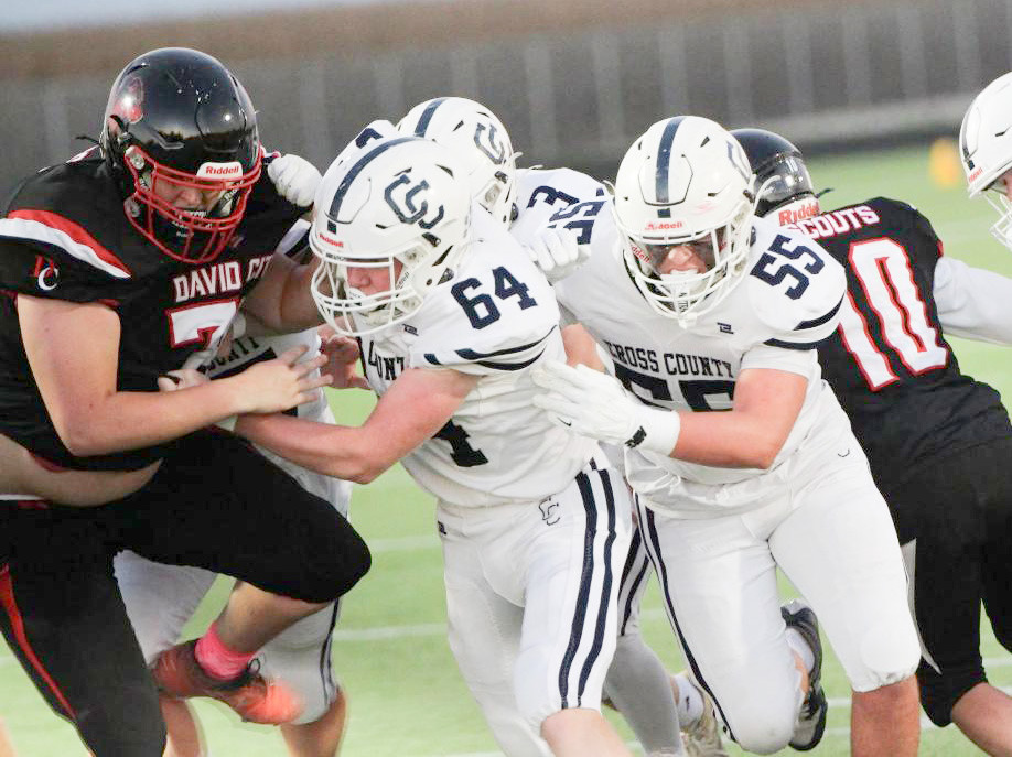 A successful running game starts up front. The Cougars ran for 356 yards on Friday at David City. Here Devin Lonsdale (64) and Gabe Nuttelman (55) clear the path for the backs. PCN photo by Travis Lane.