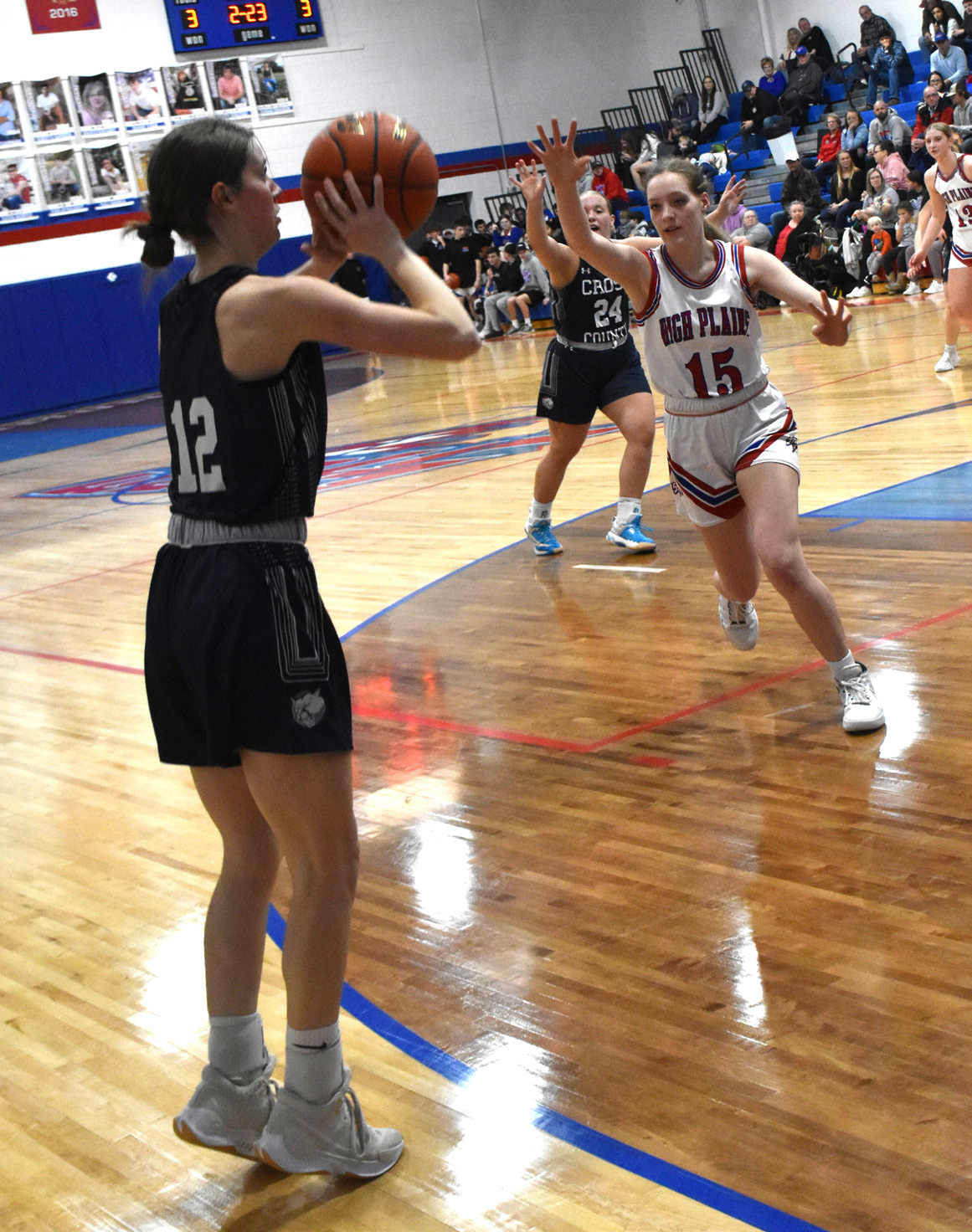 Addie Linn (CC) shoots a three as Rylee Hofmann (HPC) comes to block. PCN photo by Beth Sparrow.
