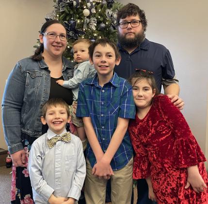 Rick and Kimberly Holtz have joined Sparrow Publications, the parent company of the Polk County News. They are joined by Calvin, 11, Penny, 8, Charlie, 5, and Timmy, 1. PCN photo