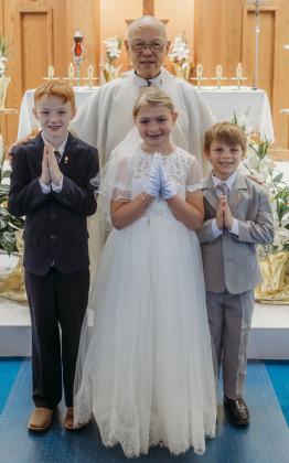 Above: Sunday, April 14th was First Communion for three youth from St. Vincent Ferrer Catholic Church in Osceola. Students receiving their First Communion were Easton Kruse (son of Jake and Giselle Kruse), Carli Mousel (daughter of Devon and Anna Mousel) and Hunter Warren (son of Chris Warren and Kendra Warren). They are pictured with Father Thomas Au. Their teacher is Andrea Herman. Photo provided.