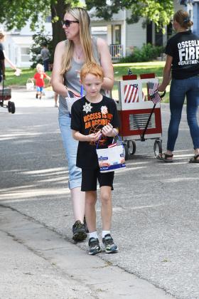 One of the highlights for children at a parade is all the candy.