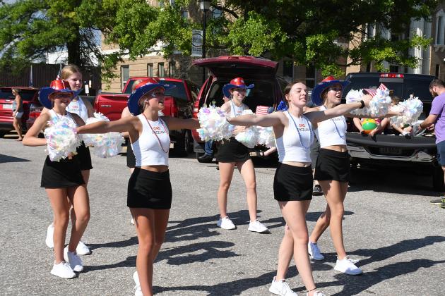 Show some spirit — the Osceola Dazzlers cheered their way through the parade.