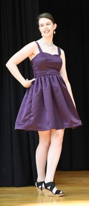 Aquinas High School Senior Rachel Wacker of Shelby shows off the dress she sewed for the Homecoming Dance. It took her more than six hours spread across multiple days to sew the matt satin dress. Polk County News Photo by Rick Holtz