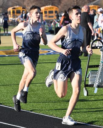 Revin Nyberg (front) and Matthew Frazier pace themselves in the 1600-meter run. PCN photo by Rick Holtz