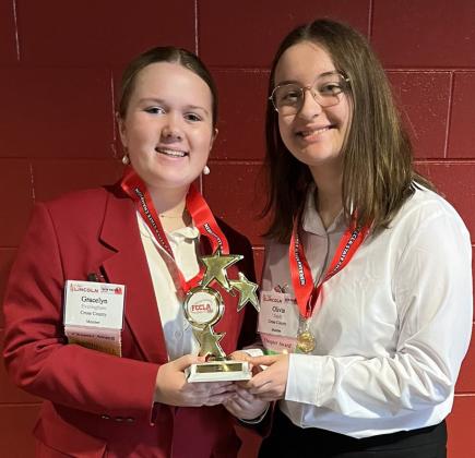 Grace Everingham and Olivia Tandy (CC) were state champions in entrepreneurship (level two) and qualified for nationals in FCCLA. Photo provided. 