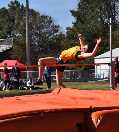Right: Alexis Wetjen (SRC) tries to clear the bar in high jump. PCN photos by Beth Sparrow.