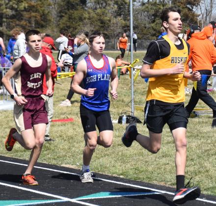 Middle: Hudson Urkoski (HPC, left) and Kasey Fischbach (SRC, right) run the 1600m run.
