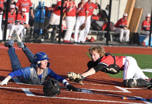 Boston Hinkle slides into home for the first run of the game. PCN photo by Rick Holtz.