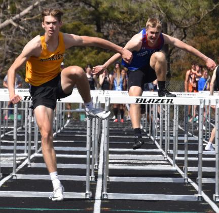 Isaac Whitmore (SRC) is one hurdle ahead of Brodey Spurling (HPC) for first in the 100m hurdles. PCN photo by Cienna Friesen. 