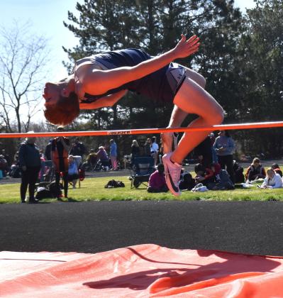Arching over the pole in high jump is Langdon Arbuck of Cross County, who placed fifth in the event. PCN photo by Beth Sparrow.