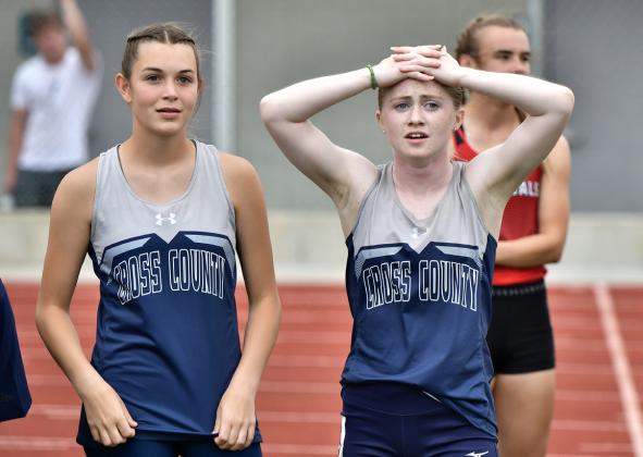 With her hands on her head after running third in the 100 meter finals at the C-6 District, Cross County freshman Piyper Berggren relaizes she would need to wait and see if her time was good enough to qualify for state. As it turned out her 12.39 (best of the year) was best among the non-automatic qualifiers in Class C. PCN photo by Rick Holtz