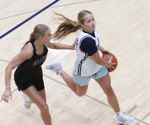 Olive Peterson drives to the basket against the Humphrey-Lindsay defense on Thursday. Peterson is the team’s leading returning scored at 6.7 points per game. PCN photos by Ken Kush