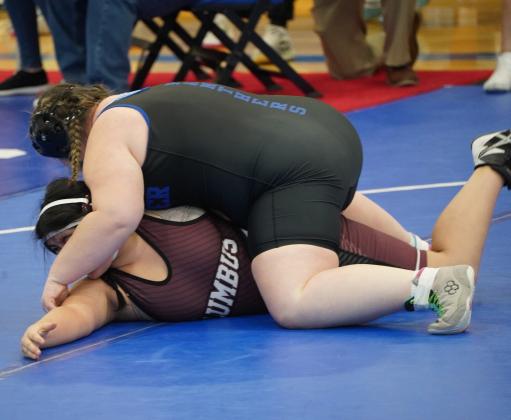Loralie Logan works on flipping her opponent, Natalia Lopez of Columbus, over for the pin. PCN photo by Jen Vrbka.