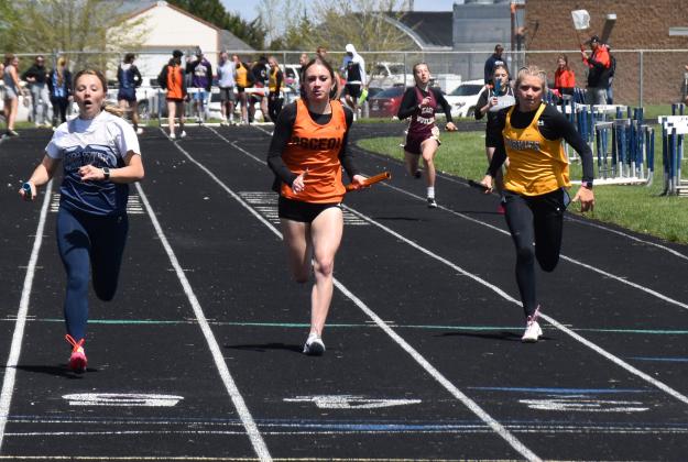 Above: Kylee Krol (CC), Alexis Burritt (OSC) and Danica Watts (SRC) finished the 4x100 relay first, second and third respectively. PCN photo by Beth Sparrow.