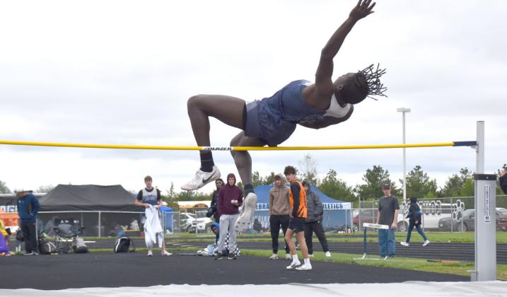 Above: James Elgin takes a leap in high jump. PCN photo by Beth Sparrow. 