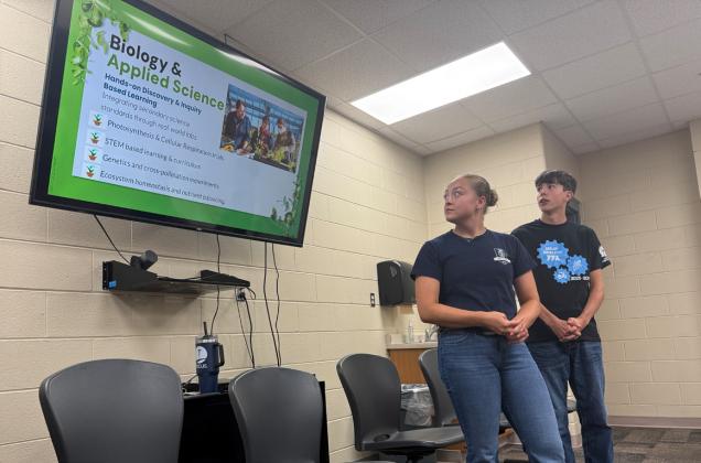 Madison Augustin and Garrett Ruth discuss the greenhouse proposal. PCN photo by Rick Holtz.