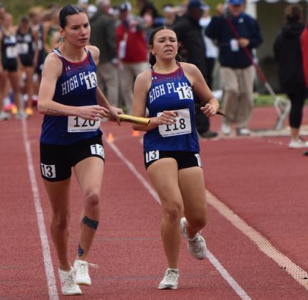 In the Class D 4X800 relay, High Plains Jacey Dubas hands the baton to senior Dakota Gress. PCN photo by Beth Sparrow