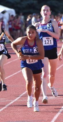Left- High Plains Peyton Hofmann makes the exchange in the 4X400 to Gahvi Lesiak.