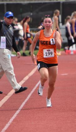 Above right- The Bulldogs Camryn Peterson blazes down the track during the Class D 100-meter prelims at the Nebraska State Track and Field Meet. PCN photos by Beth Sparrow.