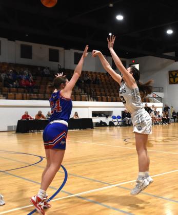ABOVE: Lindee Kelley (CC) shoots over the hands of Rylee Ackerson (HPC) at the CRC tourney. PCN photo by Beth Sparrow. BELOW: Kayleigh Ruth (SRC) shoots against David City earlier this month. PCN file photo by Beth Sparrow.