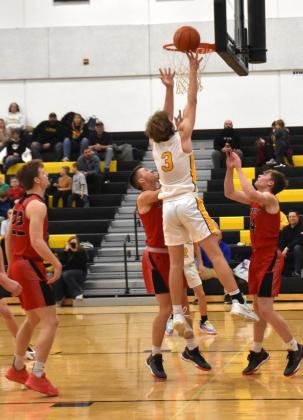 Dalton Pokorney takes the ball up for a basket against David City earlier this month. PCN file photo by Beth Sparrow.