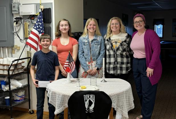 Pictured are the winners of the Stromsburg Legion’s essay contest. Left to right: Henry Cramer (1st), Molly Tandy (3rd), Cortlyn Sundberg (2nd), Mrs. Nielsen, and Mrs. Woodruff. Photo provided.