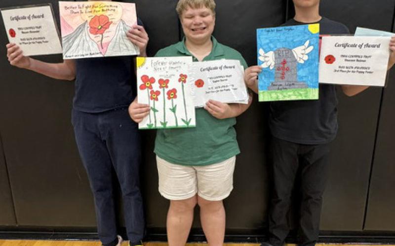 The Osceola Legion Auxiliary awarded some 8th graders for posters and essays. Left are the poppy poster winners: 1st Mason Alexander, 2nd Layton Burritt, 3rd Dawson Baloun. Right are the essay contest winners: 1st Allison Duhachek, Mason Alexander 2nd and 3rd Milo Vaughn. Mason Alexander was also the History award winner. Photos provided.