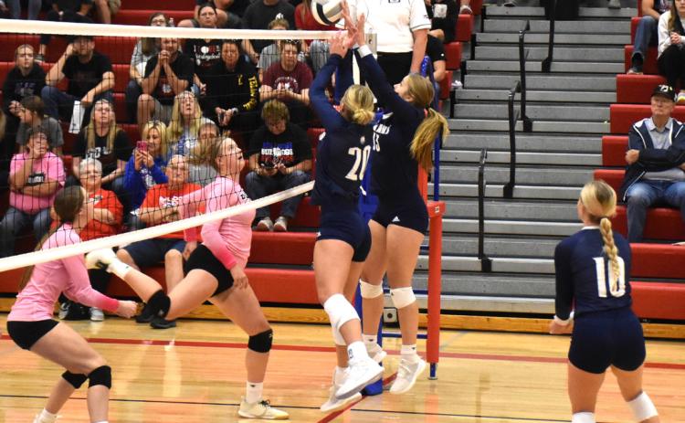 Sisters Lilly and Eden Peterson go up for the block against Humphrey-Lindsay Holy Family on Monday night in subdistrict play. PCN photo by Beth Sparrow.