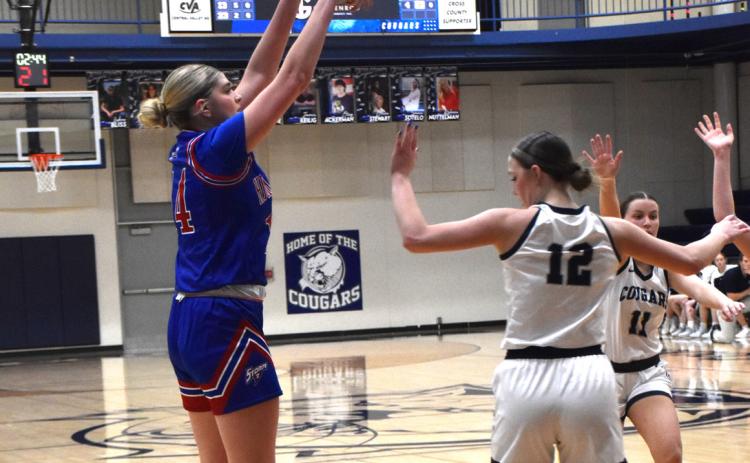 Emma Brown shoots a three against Cross County. PCN file photo by Beth Sparrow.