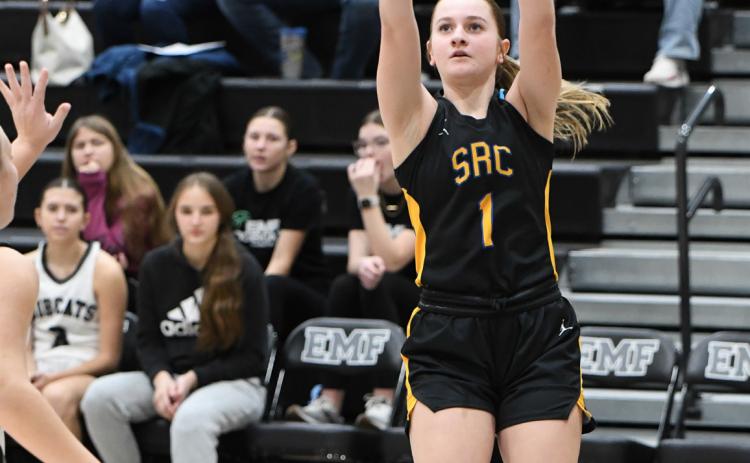 Above: Taya Pinneo shoots one. She hit 1000 career points at the holiday tourney. PCN photo by Rick Holtz.